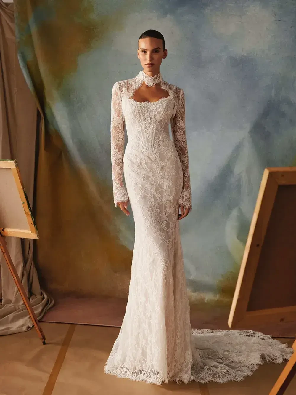 model is wearing an allover lace bridal gown